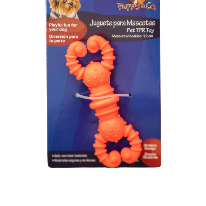 Orange dog toy with packaging featuring 'Puppy & Co' branding on a white background.