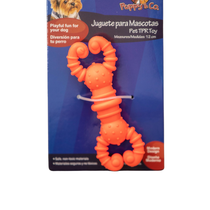 Orange dog toy with packaging featuring 'Puppy & Co' branding on a white background.